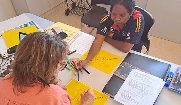 Lecturer and student from APY Lands at work