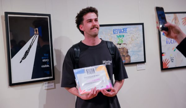 Jake Newland with his winning poster design