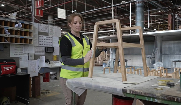 Charlie Iverson is studying furniture finishing