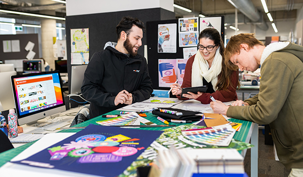 Graphic design students at work