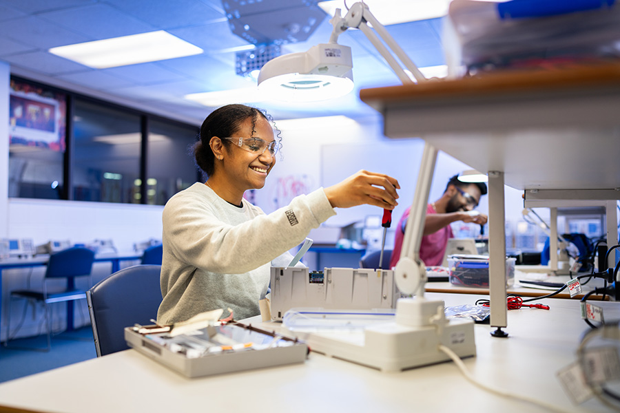 female electronics student