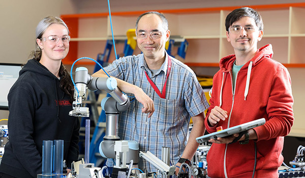 engineering students with robotics