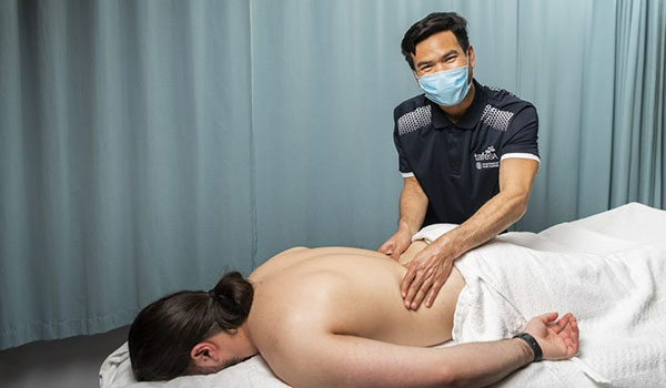 International-student-Zag-massaging-male-back
